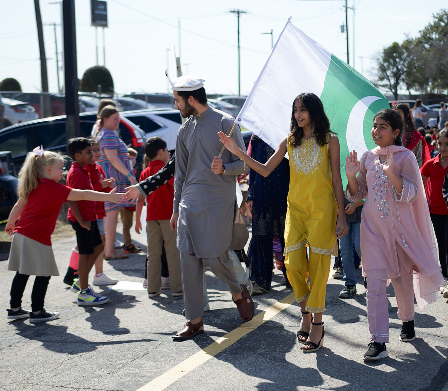An exchange student walks for Pakistan during the World Parade